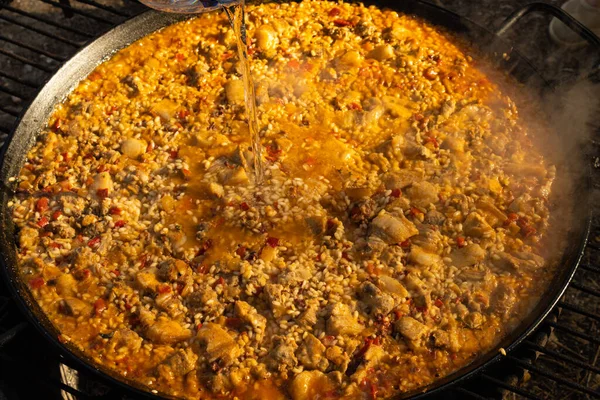 Paella cooked over firewood, typical Spanish dish
