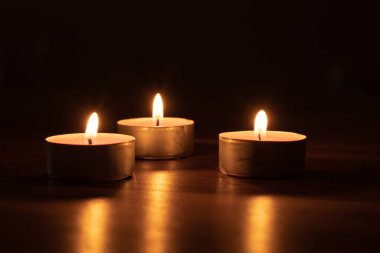 Candles on table at night