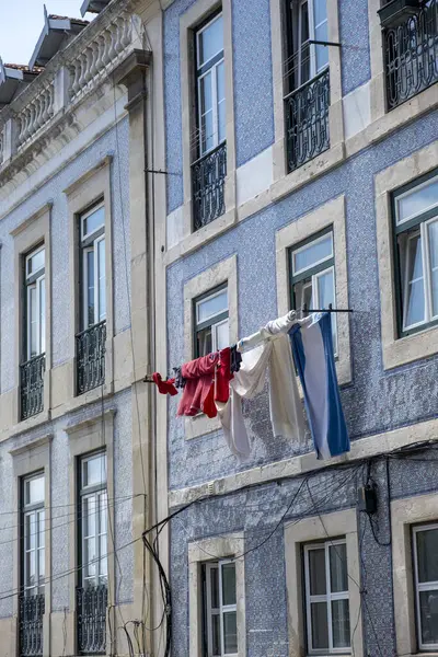 European building front with some clothes hanging