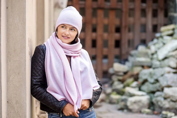 young woman in a scarf and hat
