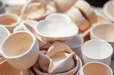 DIY and hobby concept. Lots of pottery pots in workshop.