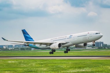 Garuda Indonesia's Airbus A330 aircraft lands at Sukarno Hatta Airport, Jakarta. clipart