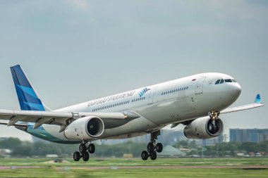 Garuda Indonesia's Airbus A330 aircraft lands at Sukarno Hatta Airport, Jakarta. clipart