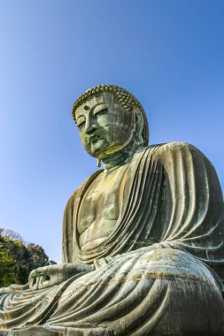 Giant, bronze Daibutsu Great Buddha statue of 1252 at the Kotoku-in Temple, in Kamakura district of Kanagawa prefecture near Tokyo, Japan. Second largest Japanese Buddha Sculpture. clipart