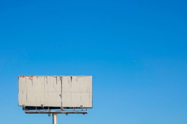 Mazarron, Spain - 17th September 2022 - old empty billboard in front of a blue sky clipart