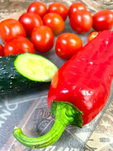 Vegetables, kitchen, benefits, health, vitamins, spring, bright, pepper, tomato, tomatoes, cucumber, kitchen, cut, table, board, knife, cook, tasty, useful, red, green