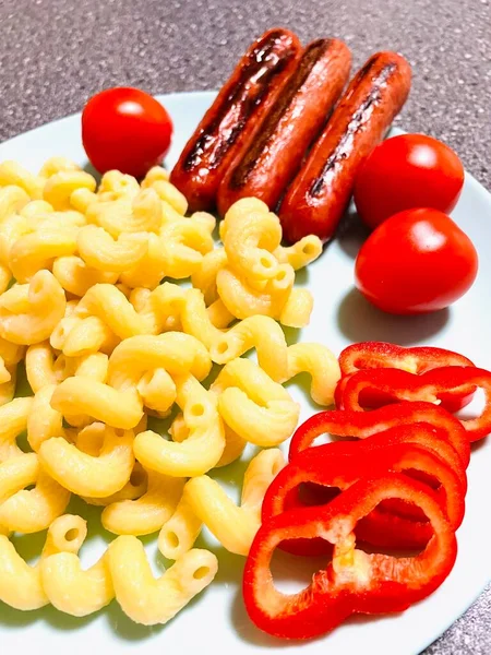 Plate, food, eat, breakfast, lunch, dinner, at home, kitchen, horns, pasta, sausages, grill, tomatoes, pepper, red, calorie content, health