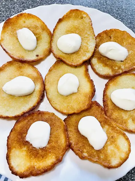 stock image Dumplings, fritters, fry, delicious, oil, potatoes, flour, plate, delicious, kitchen, cook, fire, gas, crackle, coziness, frying pan