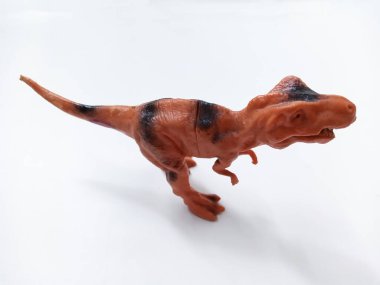 Tyrannosaurus Rex dinozor Oyuncak Figürü. Beyaz arka planda izole edilmiş plastik dinozor oyuncağı. Tyrannosaurus, büyük bir theropod dinozor cinsidir.