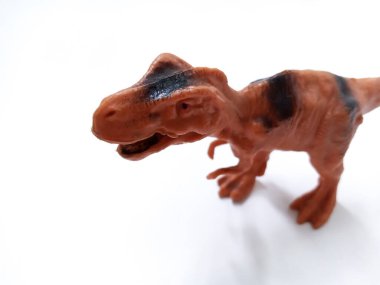 Tyrannosaurus Rex dinozor Oyuncak Figürü. Beyaz arka planda izole edilmiş plastik dinozor oyuncağı. Tyrannosaurus, büyük bir theropod dinozor cinsidir.