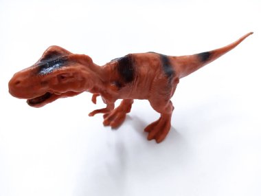 Tyrannosaurus Rex dinozor Oyuncak Figürü. Beyaz arka planda izole edilmiş plastik dinozor oyuncağı. Tyrannosaurus, büyük bir theropod dinozor cinsidir.