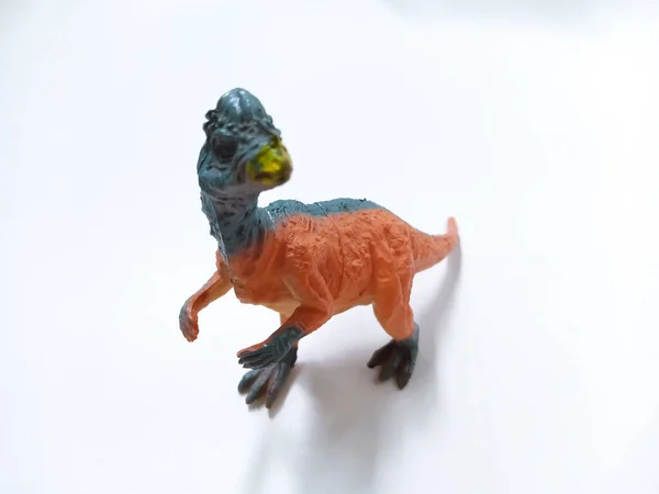 Pachycephalosaurus Toy Figure. Plastic dinosaur toy isolated on white background. Pachycephalosaurus is a genus of pachycephalosaurid dinosaurs.