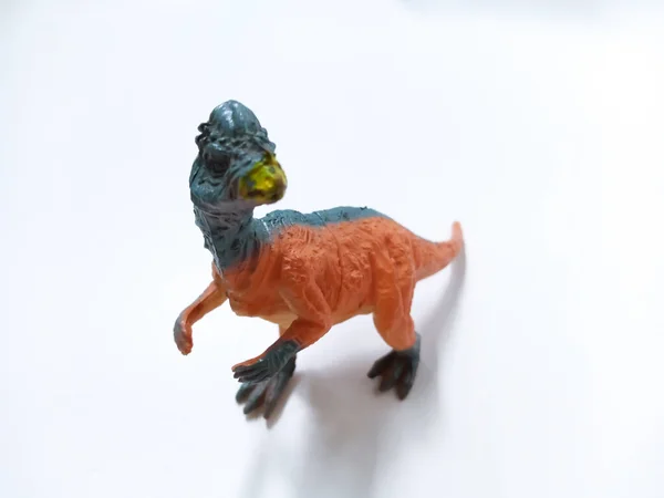 Pachycephalosaurus Toy Figure. Plastic dinosaur toy isolated on white background. Pachycephalosaurus is a genus of pachycephalosaurid dinosaurs.