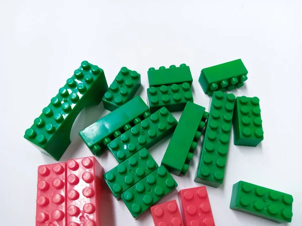 Close Up Green and Red Educational Toys Bricks Blocks isolated on White Background