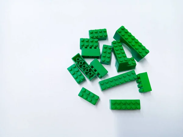 Close Up Green Educational Toys Bricks Blocks isolated on White Background