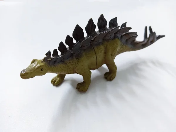 Stegosaurus dinosaur Toy Figure. Plastic dinosaur toy isolated on white background. Stegosaurus is a genus of herbivorous, four-legged, armored dinosaur