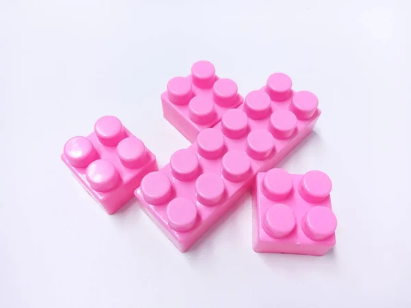 Close Up Pink Educational Toys Bricks Blocks isolated on White Background
