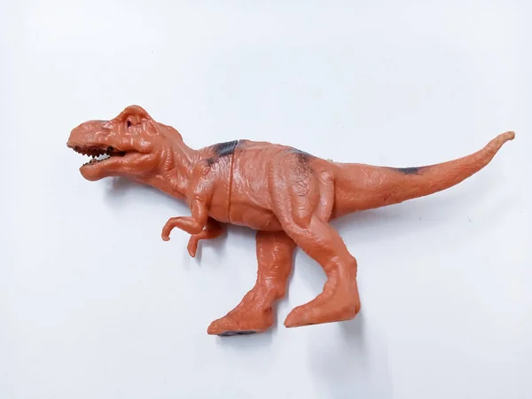 Tyrannosaurus Rex dinozor Oyuncak Figürü. Beyaz arka planda izole edilmiş plastik dinozor oyuncağı. Tyrannosaurus, büyük bir theropod dinozor cinsidir.