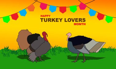 İki hindi yeşil bir çayırda oynuyor ve günbatımı arka planında küçük bir parti bayrağıyla süslenmiş. Türkiye 'yi Anma Ayı