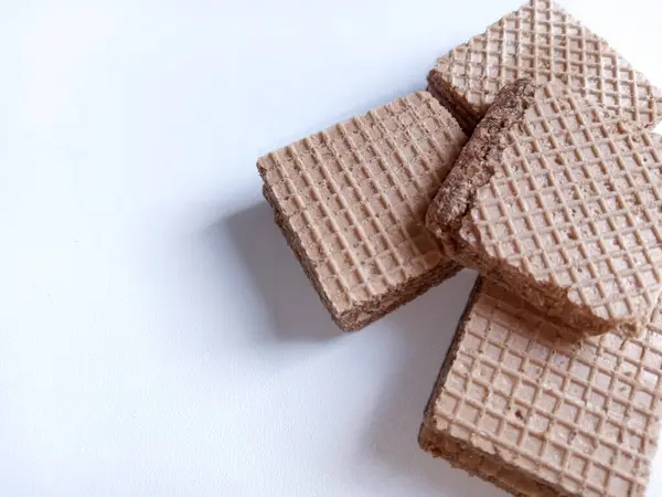 stock image cube wafer biscuits arranged with a white background and copy space