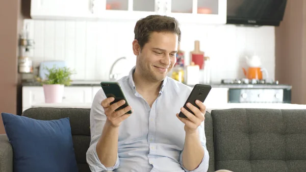 Young Man Working Hard Two Smartphones Hand Trying Keep Online — Stock Photo, Image