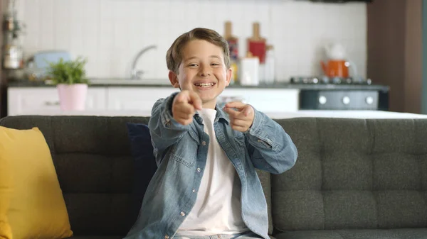 stock image Wow, hey you! Profile portrait of smiling little boy happily pointing at camera at home.Lucky picks the winner, it shows you're awesome.