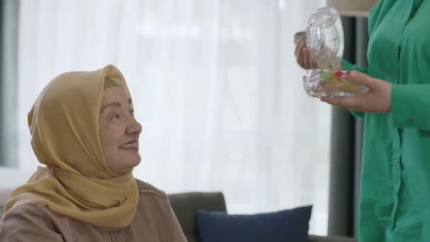 Muslim Tradition Ramadan Hijab Dressed Woman Offering Candy Her Mother — Stock Video