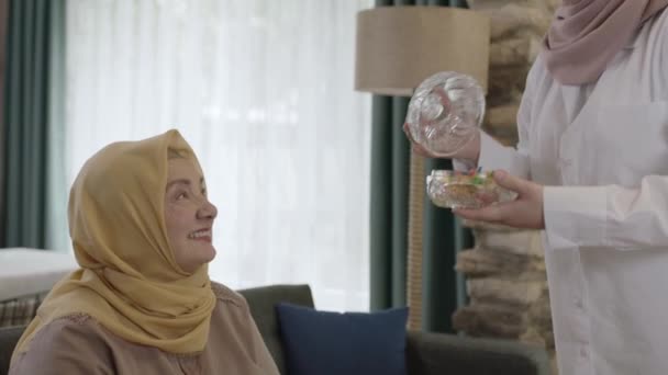 Eid Tradition Muslims Woman Wearing Headscarf Traditionally Offering Candy Her — Stock Video