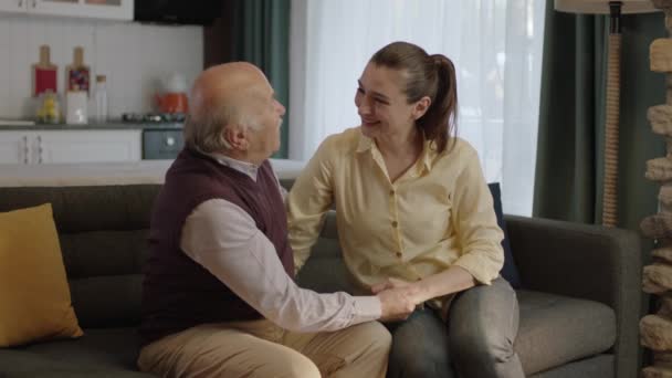 Young Woman Visiting Happy Senior Elderly Father Sitting Sofa Enjoying — Stock Video