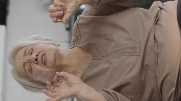 Elderly White Haired Woman Points Pill Living Room Sofa She — Stock Video