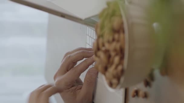 Freelance Man Drinks Coffee Eats Roasted Almonds Hazelnuts Cookies While — Wideo stockowe