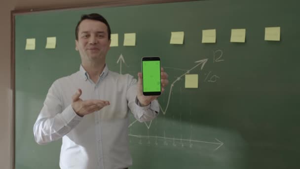 Male Teacher Front Blackboard Looking Information Phone Searching Something Internet — Wideo stockowe