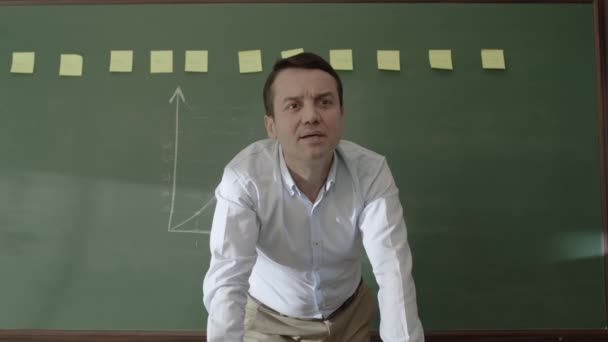 Male Teacher Standing Front Blackboard Glued Notes Chalk Drawn Math — Stockvideo