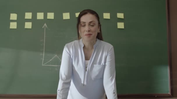 Female Teacher Standing Front Blackboard Pasted Notes Chalk Drawn Math — Wideo stockowe