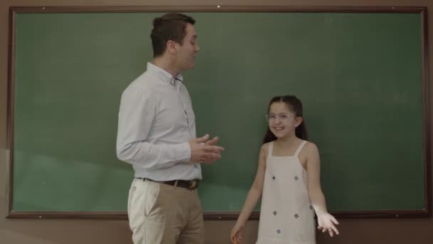 Back School Concept Young Male Teacher Hugging His Student Classroom — Vídeos de Stock