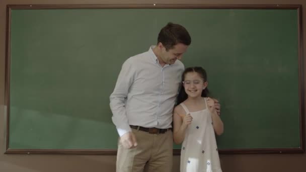 Back School Concept Young Male Teacher Hugging His Student Classroom — Stockvideo