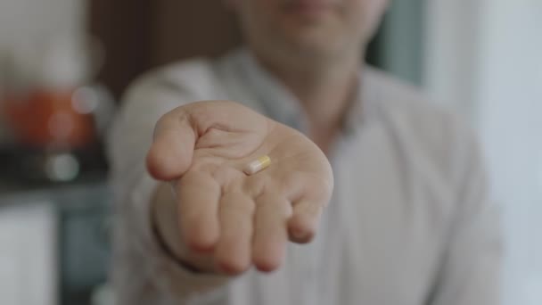 Hand Person Holding Pill Camera Man Holds Yellow Pill His — Stockvideo