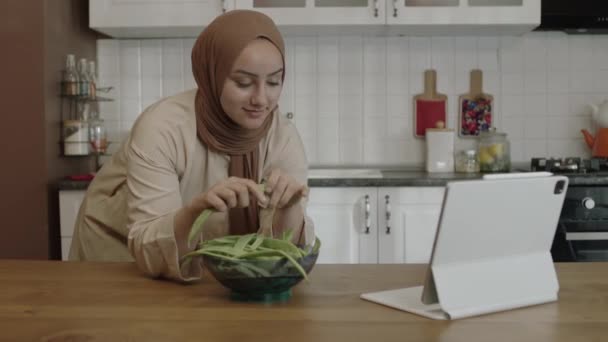 Woman Hijab Watching Recipe Funny Video Tablet Computer While Preparing — Vídeo de Stock