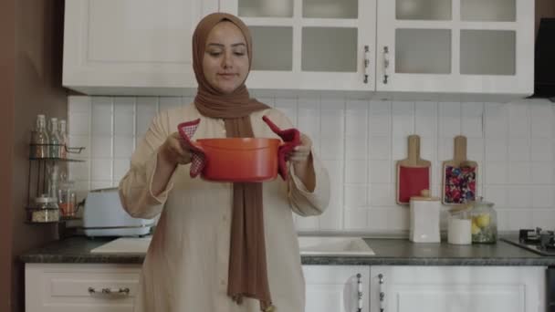 Young Mother Hijab Smells Food She Has Prepared Her Kitchen — Αρχείο Βίντεο