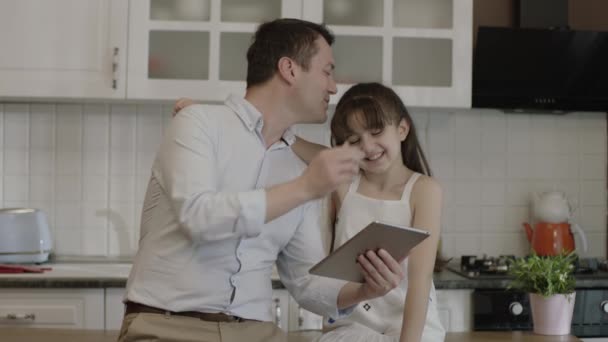 Happy Father His Little Daughter Using Tablet Computer Dinner Table — 图库视频影像