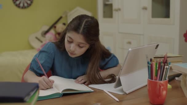 Little Girl School Student Studying Online Home Listening Teachers Video — kuvapankkivideo