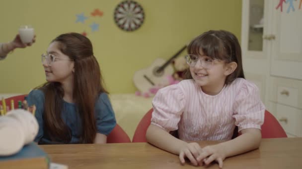 Caring Mother Brings Milk Little Girls Doing School Homework Caring — Stockvideo