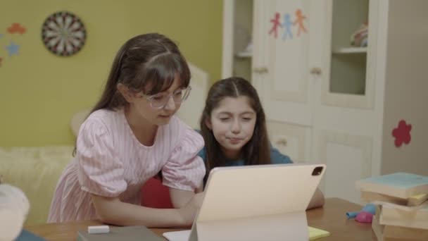 Smart Elementary School Girls Doing Math Homework Tablet Computer Sitting — Vídeo de stock