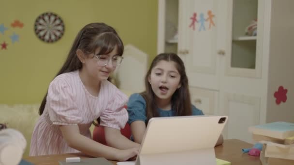 Smart Elementary School Girls Doing Math Homework Tablet Computer Sitting — 비디오