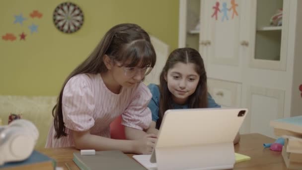 Smart Elementary School Girls Doing Math Homework Tablet Computer Sitting — Video Stock