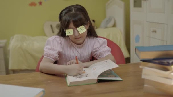 Little Girl Reading Book Her Room Heart Shaped Papers Her — Stok video