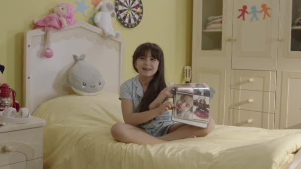 Happy Cute Little Girl Looking Childhood Photos Herself Her Album — Stock Video