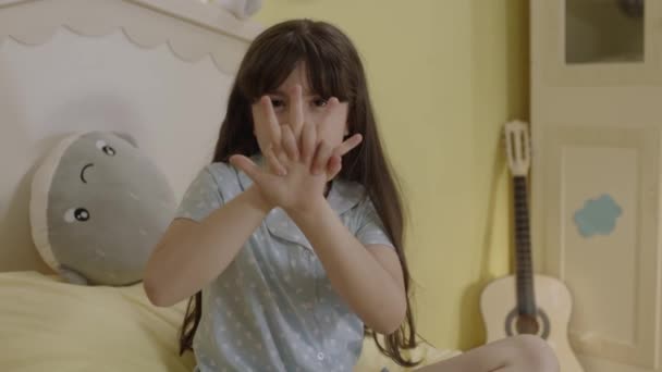 Little Girl Doing Magic Tricks Her Fingers Bedroom Boy Who — Vídeo de Stock