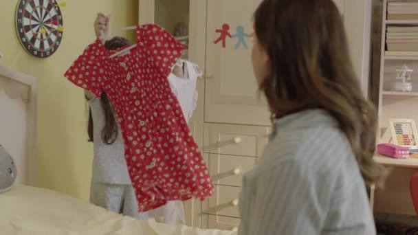 Girl Satisfied Her Old Clothes She Cannot Choose Which Outfit — Vídeo de Stock
