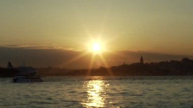 Istanbul view at sunset.Lens flare formed by the sun falling on the camera.